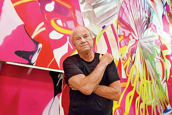 James Rosenquist in front of his work